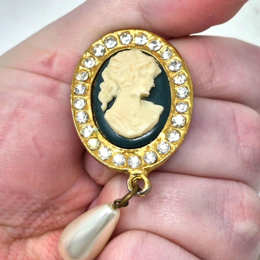 Cameo Gold Toned Oval Pendant With Jems Around Outside And Pearl Type Dangle